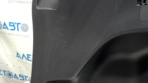 Left arch trim for a 2022 Toyota Highlander, black, hybrid, with cup holders and caps, scratches