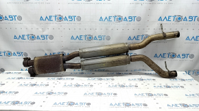 The exhaust pipe, the middle part of the Jaguar F-Pace X761 17-25, is rusty and dented.