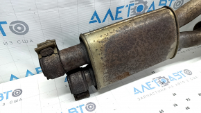 The exhaust pipe, the middle part of the Jaguar F-Pace X761 17-25, is rusty and dented.