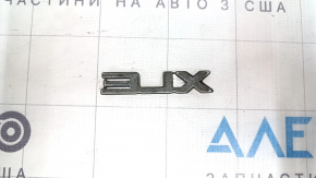 The XLE emblem on the tailgate of the Toyota Highlander 20-25 is black.