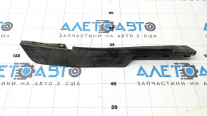 The right front bumper mudguard of a Jaguar F-Pace X761 17-20 is dented and worn.