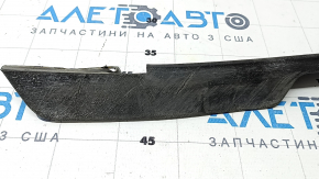 The right front bumper mudguard of a Jaguar F-Pace X761 17-20 is dented and worn.