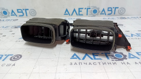 The Toyota Highlander 20-25's central dashboard air vent has a broken mount.
