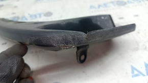The front right mudguard of a Toyota Highlander 20-25 is torn and worn.