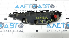 The left front bumper mount for a Toyota Sienna 21-24 has a broken latch.