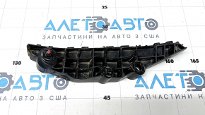 The left front bumper mount for a Toyota Sienna 21-24 has a broken latch.