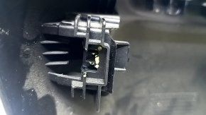 The passenger seat control cover for the Fiat 500L 14-20 is black, scratched, and the mount is broken.