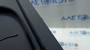 The passenger seat control cover for the Fiat 500L 14-20 is black, scratched, and the mount is broken.