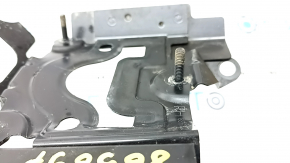 The BSM blind spot sensor bracket, right, for Toyota Sienna 21-25, is dented.