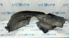 The rear left fender liner of a Toyota Camry v50 12-14 USA is torn.