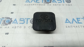 The towbar plug on a Toyota Highlander 20-24 is dented.