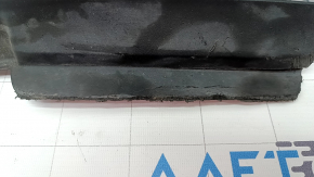The left front bumper mudguard of a Tesla Model X 16-21 is sawed off and the mount is broken.