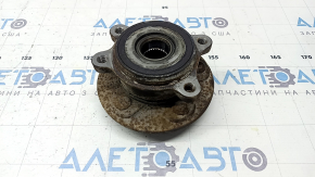 The front left hub of a Toyota Sienna 21-25 is rusty.