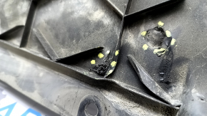 Tesla Model X 16-21 front bumper guard is scuffed, dented, and has tears