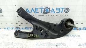 The rear left trailing arm of a Toyota Sienna 21-24 has a cracked silent block.