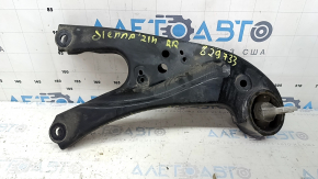 The rear right longitudinal control arm of a Toyota Sienna 21-24 has a cracked silent block.