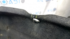 The front right fender liner of a Toyota Sienna 21-24 has a torn fastener.