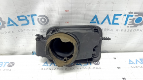 The fuel filler flap housing of a BMW 5 F10 11-16 has a broken latch and a torn seal.