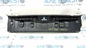 The trunk opening trim of the BMW 5 F10 11-16 is worn and scratched.