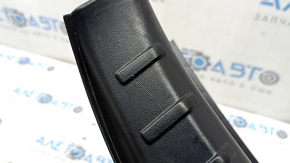 The trunk opening trim of the BMW 5 F10 11-16 is worn and scratched.