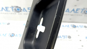 The trunk opening trim of the BMW 5 F10 11-16 is worn and scratched.