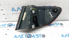 The left outer fender light of a BMW 5 F10 14-16 is worn out.