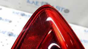 The left outer fender light of a BMW 5 F10 14-16 is worn out.