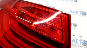 The left outer fender light of a BMW 5 F10 14-16 is worn out.