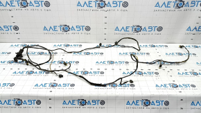 The wiring for the rear bumper of a BMW 5 F10 11-16 for parking sensors and a foot-operated trunk lid opening sensor is cut and the seal is torn.
