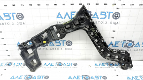 The rear bumper mount, right outer, VW Atlas 21-25, is broken.