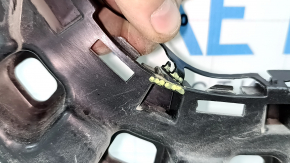 The rear bumper mount, right outer, VW Atlas 21-25, is broken.