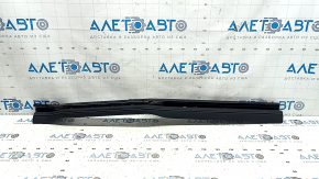 Right lower front panel trim for VW Atlas 24-25, black leather with white stitching and black molding, scratches