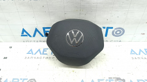 The VW Atlas 21-25 driver's steering wheel airbag is black and scratched.