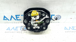 The VW Atlas 21-25 driver's steering wheel airbag is black and scratched.