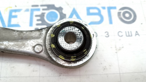 The upper rear right front control arm of a Tesla Model X 16-21 has a torn silent block.