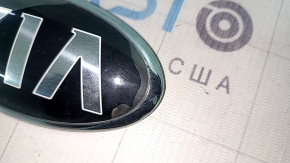 The KIA emblem badge on the front bumper of the Kia Niro 17-22 has swollen paint and sand.