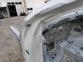 Front left quarter panel of a VW Atlas 18-25, white, dented pillar