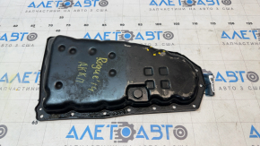 The Nissan Rogue 14-20 automatic transmission oil pan is dented.