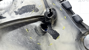 Left underbody protection for VW Atlas 18-25 is dented and torn.