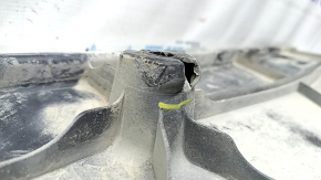 Left underbody protection for VW Atlas 18-25 is dented and torn.