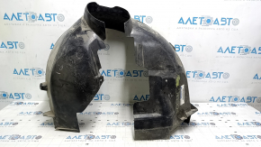 The front left fender liner of a Ford Focus mk3 11-18 is torn, missing a fragment