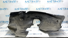 The front left fender liner of a Ford Focus mk3 11-18 is torn, missing a fragment
