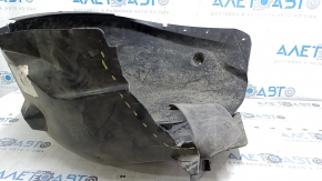 The front left fender liner of a Ford Focus mk3 11-18 is torn, missing a fragment
