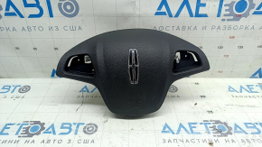 The Lincoln MKC 15-19 driver's steering wheel airbag is black, with the airbag outline visible.