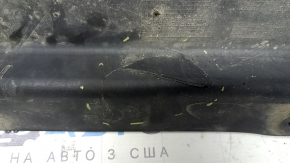 The rear left underbody protection of the BMW X3 G01 18-21 is torn and dented.