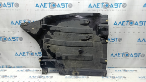 The rear right underbody protection of the BMW X3 G01 18-21 is torn, dented, missing a fragment