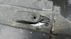 The rear right underbody protection of the BMW X3 G01 18-21 is torn, dented, missing a fragment