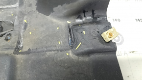 The rear right underbody protection of the BMW X3 G01 18-21 is torn, dented, missing a fragment