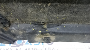The rear right underbody protection of the BMW X3 G01 18-21 is torn, dented, missing a fragment
