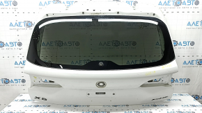 The trunk door is bare with glass, the upper part of the BMW X5 G05, 19-24 tinted, white 300, scratches on the glass
